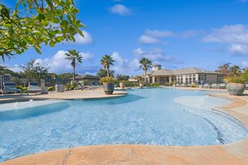 Resort-inspired swimming pool with tanning deck